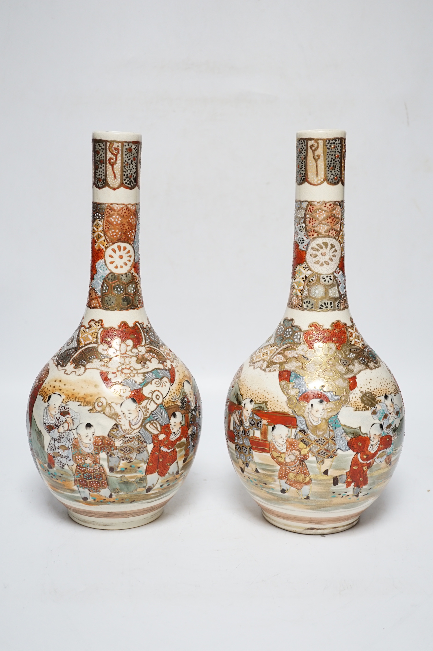 A pair of Japanese Satsuma vases and a pair of Chinese carved figural ox groups, carvings 25cm high